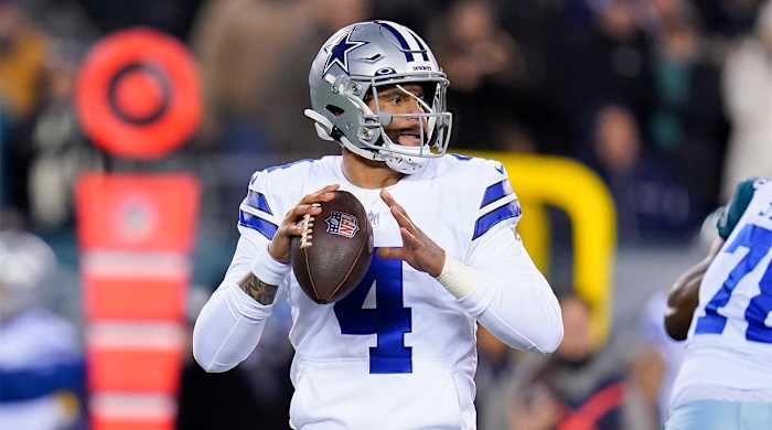 Dallas Cowboys quarterback Dak Prescott looks to pass during the first half of an NFL football game against the Philadelphia Eagles, Saturday, Jan. 8, 2022, in Philadelphia.
